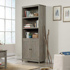 Sauder Cottage Road Book Shelf, Bookshelf with Storage, Library Bookcase with Doors and Adjustable Shelves, in Mystic Oak Finish
