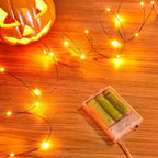 Minetom Halloween Fairy Lights, 33Ft 100 LED Battery Operated Fairy Lights, Waterproof Copper Wire Mason Jar Lights for Home Party Ghost Haunted House Indoor Outdoor Halloween Decorations, Orange